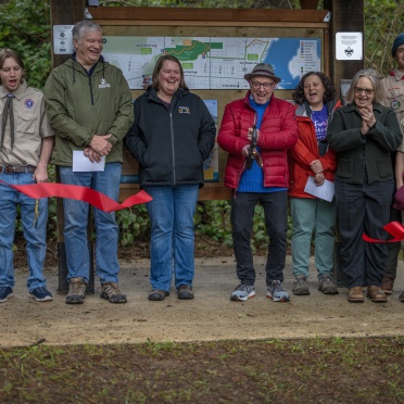 Cutting the ribbon at the Agate Beach TRACK Trail Opening