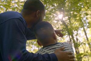 Father and son in the forest