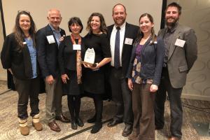 KIP and BCBSNC Foundation Staff pose for a picture with the award