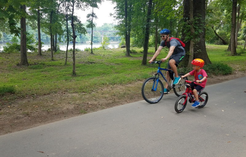 Family biking along the trail