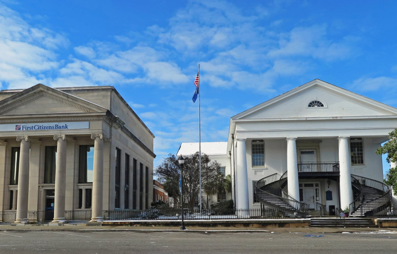 a view of two winnsboro town buildings
