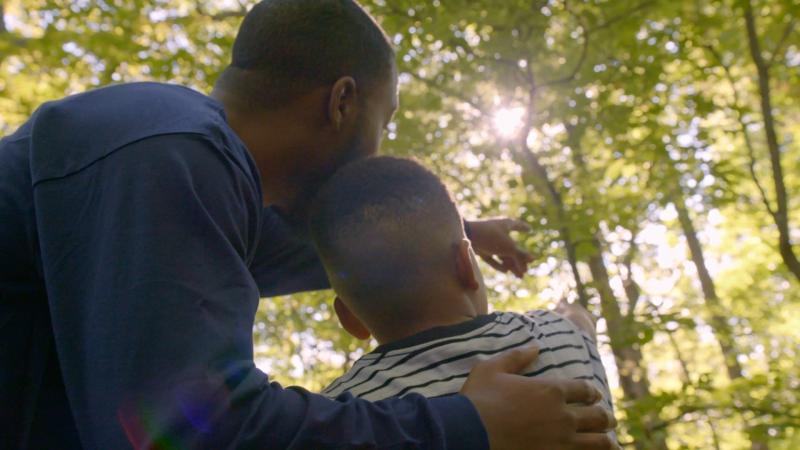 Father and son in the forest