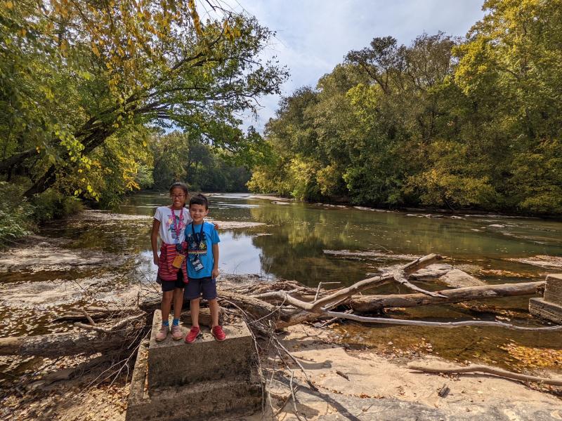 MiniLu & Toshi posing in front of the river