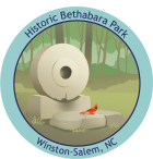 Track Trail sticker for Historic Bethabara Park, featuring a Northern Cardinal on an old mill stone. 