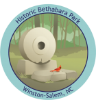 TRACK Trail sticker for Historic Bethabara Park, with a Northern Cardinal on an old mill stone you pass along the trail.. Track Trail sticker for Historic Bethabara Park, featuring a Northern Cardinal on an old mill stone.