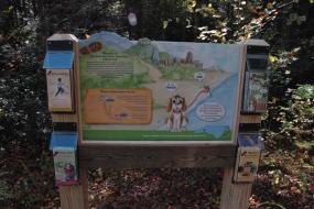Kids in Parks trailhead with activity brochures