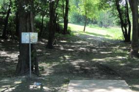 disc golf sign and the starting point for one of the holes on the course