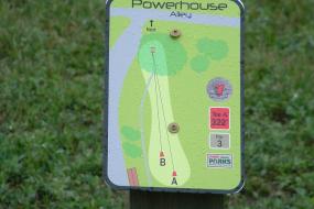 close up of a disc golf sign