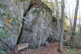 Benches by rock face