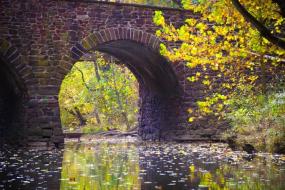 Water flowing under a stone bridge