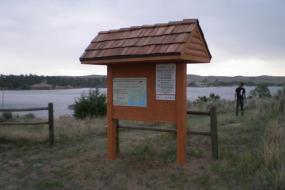 Kiosk for the course with the reservoir in the background