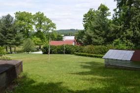 Open grassy area near barns
