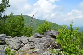 Pile of rocks in front of mountain view