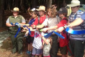 Ribbon cutting at the grand opening of the trail
