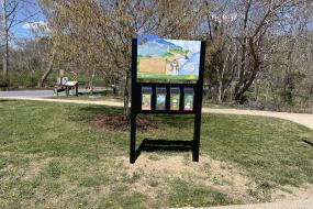 Kiosk at Jordan's Point Park near another interpretive sign