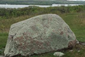 Large boulder in front of the lake
