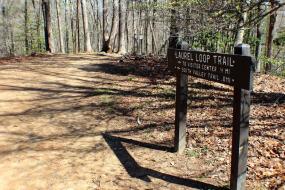 Trail distance sign beside the trail
