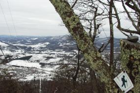 Snowy landscape view high up on trail during winter