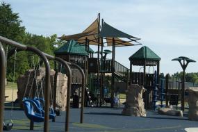 The playground at Creekside Park, with swings.