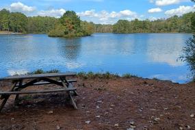 A picnic table on the banks of Sesquicentennial's 30-acre lake.