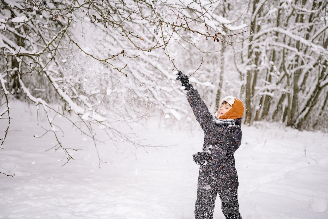 Boy playing in the snow